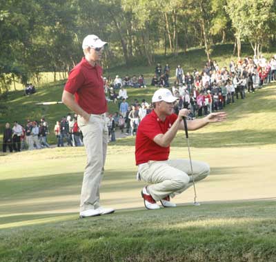 In harmony throughout - the Swedish duo line up a putt on 17.