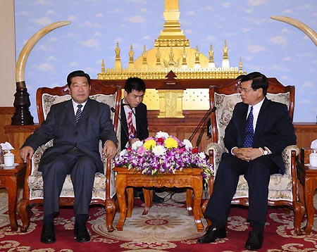 Jia Qinglin (L), member of the Political Bureau Standing Committee of the Central Committee of the Communist Party of China (CPC) and chairman of the National Committee of the Chinese People's Political Consultative Conference (CPPCC), meets with Bouasone Bouphavanh (R), member of the Political Bureau of the Central Committee of the Lao People's Revolutionary Party and Lao prime minister, in Vientiane, Laos, Dec. 1, 2008.[Li Tao/Xinhua]