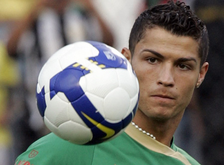 Cristiano Ronaldo of Portugal controls the ball during a training session in Brasilia Nov. 18, 2008. Cristiano Ronaldo won the Golden Ball awarded to the European Footballer of the Year on Tuesday, becoming the fourth Manchester United player to take the honour and the first since fellow winger George Best in 1968.[Xinhua/Reuters]