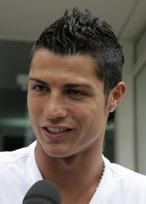 Portugal's soccer player Cristiano Ronaldo answers questions from journalists after a treatment session on his injured right ankle at a physiotherapy centre in Lisbon July 11, 2008. [Xinhua/Reuters]