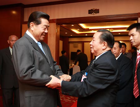 Jia Qinglin (front, L), member of the Political Bureau Standing Committee of the Central Committee of the Communist Party of China (CPC) and chairman of the National Committee of the Chinese People's Political Consultative Conference (CPPCC), meets with Sisavath Keobounphanh, member of the Political Bureau of the Central Committee of the Lao People's Revolutionary Party and chairman of the Lao Front for National Reconstruction ( LFNR), in Vientiane, Laos, Dec. 1, 2008.