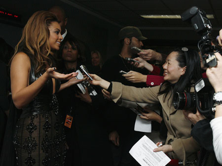 Cast member Beyonce Knowles speaks with reporters at the premiere of 'Cadillac Records' in New York December 1, 2008. 