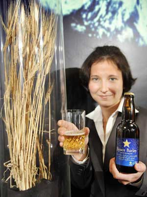 A students shows the space beer, brewed from barley cultivated in the International Space Station in 2006 in Tokyo on Dec. 2, 2008. Japan's beer giant Sapporo will produce 100 liters of the 5.5 percent alcoholic brew which are not for sale in the next year.[Xinhua/AFP]