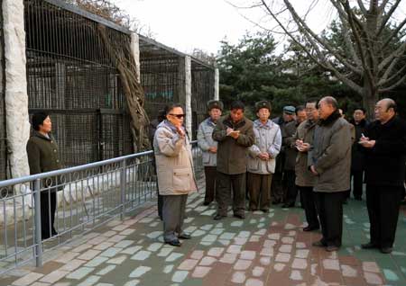 This undated photo released on Dec. 2, 2008 by the official Korean Central News Agency (KCNA) shows Kim Jong Il (C), top leader of the Democratic People's Republic of Korea (DPRK), inspecting a Pyongyang zoo which is under reconstruction.[Xinhua/KCNA]