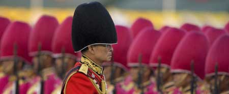 Thailand's revered King Bhumibol Adulyadej attends the annual Trooping of the Colour, an annual military parade, in Bangkok's Royal Plaza on Dec. 2, 2008.[Xinhua/Reuters] 