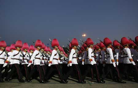 The guard of honour march in Bangkok's Royal Plaza as Thai King Bhumibol Adulyadej (unseen) attends the Trooping of the Colour, an annual military parade, Dec. 2, 2008.[Xinhua/Reuters]