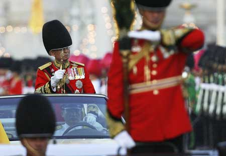 Thailand's revered King Bhumibol Adulyadej attends the annual Trooping of the Colour, an annual military parade, in Bangkok's Royal Plaza on Dec. 2, 2008.[Xinhua/Reuters]