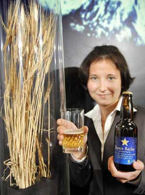 A students shows the space beer, brewed from barley cultivated in the International Space Station in 2006 in Tokyo on Dec. 2, 2008. Japan's beer giant Sapporo will produce 100 liters of the 5.5 percent alcoholic brew which are not for sale in the next year. [Xinhua/AFP]