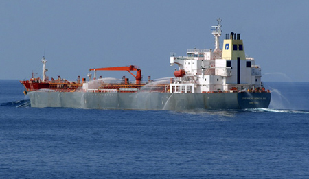 The Hong Kong flagged merchant ship M/V Overseas Hercules uses fire hoses as a countermeasure against a possible pirate attack in the Gulf of Aden December 2, 2008. According to NATO headquarters in Naples, the Italian naval destroyer ITS Luigi Durand de la Penne arrived following a distress call and instructed the vessel to use its fire hoses to thwart an attack. No attack was made on the ship. [China Daily via Agencies]