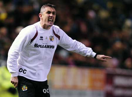 Burnley's coach Owen Coyle gestures during their English League Cup soccer match against Arsenal in Burnley, northern England Dec. 2, 2008. 