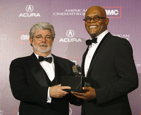 George Lucas (L) presents actor Samuel L. Jackson with the 23rd American Cinematheque Award in Beverly Hills December 1, 2008. 