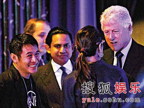 Former U.S. President Bill Clinton (R), Malaysian actress Michelle Yeoh (2nd from right), and Hong Kong actor Jet Li (L), attend the Clinton Global Initiative meeting in Hong Kong on Tuesday, Dec. 2, 2008.