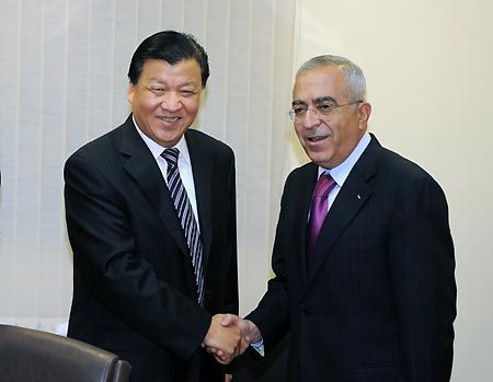 Palestinian Prime Minister Salam Fayyad (R) meets with Liu Yunshan, member of the Communist Party of China (CPC) Central Committee Political Bureau and head of the CPC Central Committee Publicity Department, in the West Bank city of Ramallah, Dec. 3, 2008. [Yin Bogu/Xinhua]