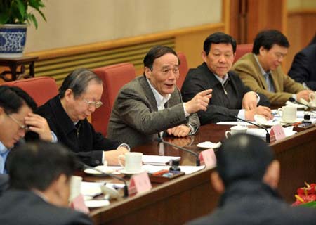 Chinese Vice Premier Wang Qishan (4th, L) speaks at a meeting on foreign and domestic trade on Nov. 2, 2008. [Xinhua]