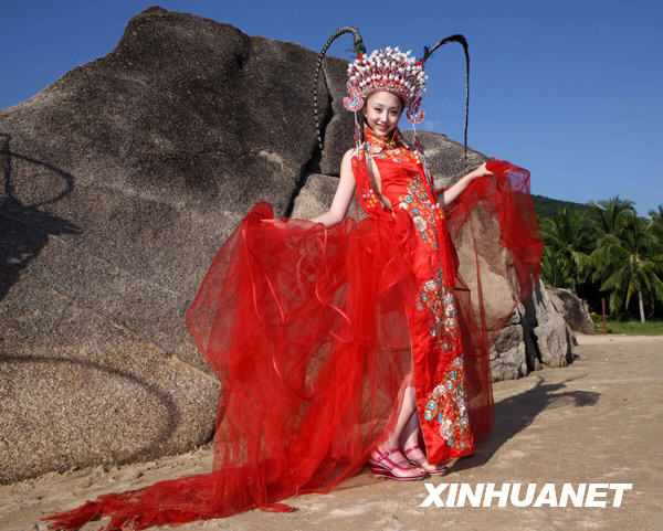 A competitor displays a wedding dress during China 2008 Xinsilu model contest in Sanya of south China's Hainan Province, Dec. 2, 2008. 