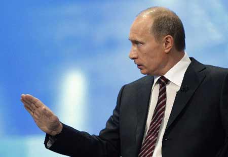 Russia's Prime Minister Vladimir Putin answers questions during his annual question-and-answer session with the Russian people in Moscow, December 4, 2008.