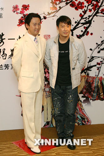 Actor Leon Lai poses with a newly-installed wax figure of himself at the Madame Tussaudes museum in Shanghai on December 3, 2008.