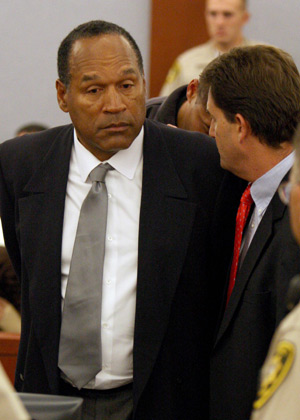 O.J. Simpson talks to his attorney Yale Galanter (R) as he is taken into custody after being convicted on all charges in his Las Vegas kidnapping and robbery trial at the Clark County Regional Justice Center in Las Vegas October 3, 2008. 