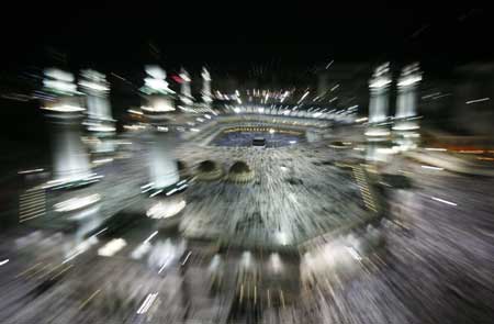 Muslim Pilgrims circle the Kaaba at the Grand Mosque in Mecca Dec. 5, 2008. [Xinhua/Reuter]