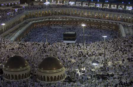 Muslim Pilgrims pray at the Grand Mosque in Mecca Dec. 5, 2008. Over two million Muslim pilgrims arrive in the holy city of Mecca this week for the Haj pilgrimage, one of the world's biggest displays of mass religious devotion and duty for able-bodied Muslims. The climax of the pilgrimage is on Sunday when worshippers spend the day gathered en masse on and around Mount Arafat, about 15 km (10 miles) east of Mecca. [Xinhua]