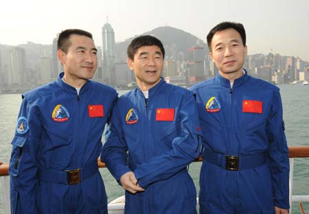 Chinese taikonauts of the Shenzhou VII space mission, (L-R) Zhai Zhigang, Liu Boming and Jing Haipeng pose for a photo during their tour in Hong Kong of south China on Dec. 6, 2008. [Huang Jingwen/Xinhua] 