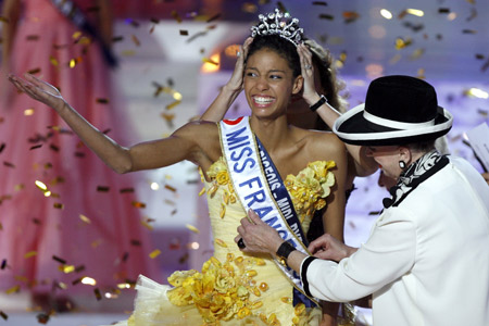 Miss France 2009 Chloe Mortaud from the Albigeois Midi Pyrenees region surrounded by Miss France committee President Genevieve De Fontenay (R) reacts after winning the title in Le Puy du Fou, western France, December 6, 2008. 