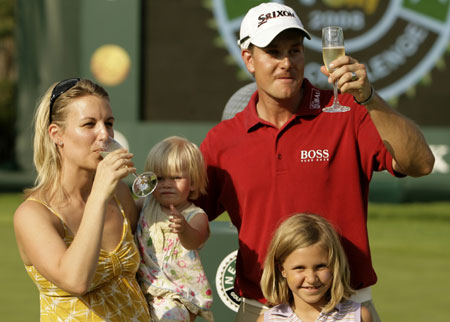 Henrik Stenson, his wife Emma, his daughter Lisa and his manager's daughter Elsa Schombie (bottom R) celebrate after the Sun City Challenge golf tournament December 7, 2008. Stenson won the Sun City Challenge by nine strokes at the Gary Player Country Club on Sunday.[Agencies]