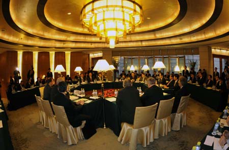 Envoys from the six nations to the Korean Peninsular nuclear talks gather to hold talks in the Diaoyutai State Guesthouse in Beijing, on Dec. 8, 2008. A new round of the six-party talks is begun here Monday afternoon for a fresh round of talks on the denuclearization of the Democratic People's Republic of Korea (DPRK). [Wang Jianhua/Xinhua]