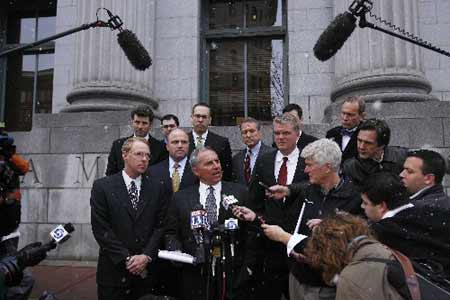 Mark Hulkower (C) and fellow defense attorneys speak to members of the media outside of the U.S. District Court after five Blackwater security guards were charged with killing 14 unarmed civilians and wounding 20 others in a 2007 shooting in Baghdad, in Salt Lake City, Utah, December 8, 2008.