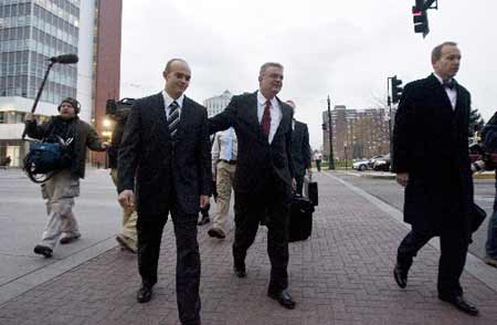 Former Blackwater Worldwide security guard Nick Slatter, (center L) arrives with his lawyer Thomas Connolly (center R), at the U.S. District Court before surrendering to authorities in Salt Lake City, Utah December 8, 2008.