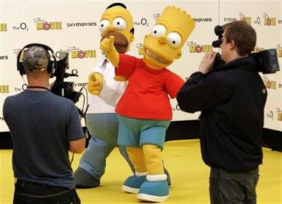 Homer and Bart Simpson characters of the television programme The Simpsons pose in London July 25, 2007.