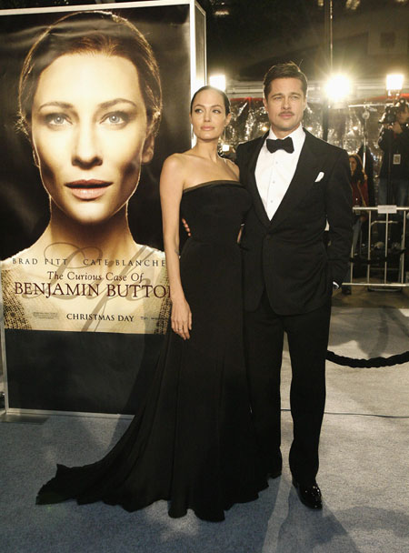 Cast member Brad Pitt and his partner actress Angelina Jolie attend the premiere of the movie 'The Curious Case of Benjamin Button' at the Mann's Village theatre in Westwood, California December 8, 2008. The movie opens in the U.S. on December 25. 