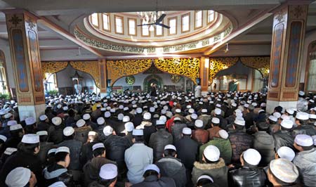 Chinese Muslims attend a prayer at a mosque in Yinchuan, northwest China's Ningxia Hui Autonomous Region, on Dec. 9, 2008. Muslims of Ningxia Hui Autonomous Region celebrated on Tuesday the Eid al-Adha festival, which falls on Dec. 9 this year. (Xinhua/Wang Peng)