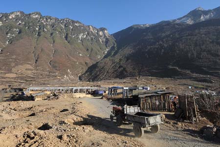 Photo taken on Dec. 8, 2008 shows the construction site in Luobozhai Village of Yanmen Township, the quake-hit Wenchuan County, southwest China&apos;s Sichuan Province. Luobozhai, less than 10 kilometers from the county seat, is the biggest Qiang ethnic village existing in China. The village was once the capital of the ancient Qiang King and then called &apos;the city upon the clouds&apos;.