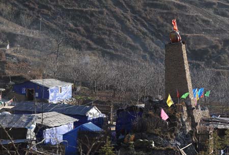 Photo taken on Dec. 8, 2008 shows the altar in Luobozhai Village of Yanmen Township, the quake-hit Wenchuan County, southwest China&apos;s Sichuan Province. Luobozhai, less than 10 kilometers from the county seat, is the biggest Qiang ethnic village existing in China. 