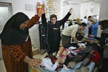 Wounded Iraqis receive treatment at a hospital in the northern city of Kirkuk, some 225 kms from Baghdad, on December 11, 2008. 