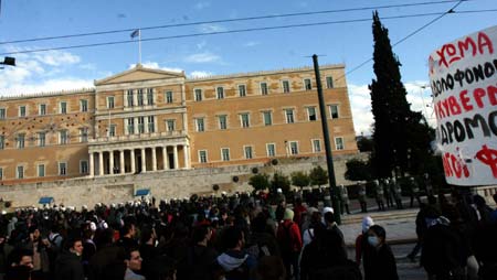 Greek youths take part in a protest march in Athens, capital of Greece, Dec. 12, 2008. Riot police on Friday clashed with youths on the seventh day of Athens riots triggered by the death of the 15-year-old boy last Saturday. (Xinhua/Yang Shaobo)