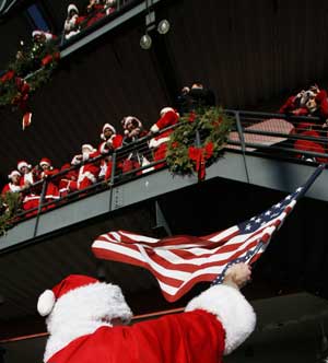 Revellers dressed as Santa Claus partake in the annual 'SantaCon' event in New York Dec. 13, 2008.