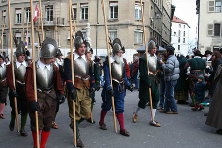 People in ancient costumes and with lances march on a street to celebrate L'Escalade in Geneva's Old Town, Switzerland, Dec. 13, 2008. The L'Escalade (scaling the wall) was celebrated here on Saturday to commemorate the city's defeat of a surprise attack on Dec. 11, 1602. 