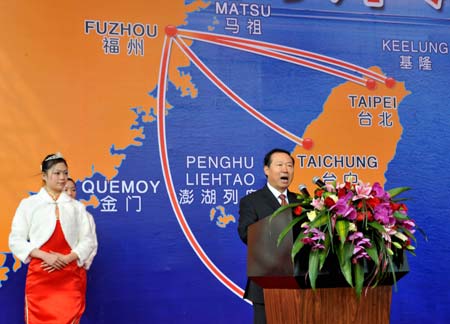 Wang Zaixi (R), vice chairman of the Chinese mainland's Association for Relations Across the Taiwan Straits, addresses the ceremony for the start of direct sea transport between China's mainland and Taiwan, at Mawei port in Fuzhou, capital of southeast China's Fujian Province, Dec. 15, 2008. The Chinese mainland and Taiwan started direct air and sea transport and postal services Monday morning. (Xinhua/Zhang Guojun) 