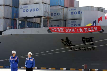 Container ship 'Yuanhe' of China Ocean Shipping (Group) Company (COSCO) departs for Kaohsiung Port in southeast China's Taiwan, from Yangshan Deep-water Port in Shanghai, east China, Dec. 15, 2008. 