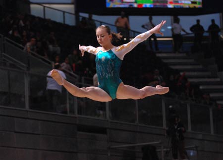 Australia's Lauren Mitchell competes during the women's beam final at the 14th Artistic Gymnastics World Cup in Madrid, capital of Spain, on Dec. 14, 2008. Mitchell claimed the title of the event with a result of 15.250 points. 