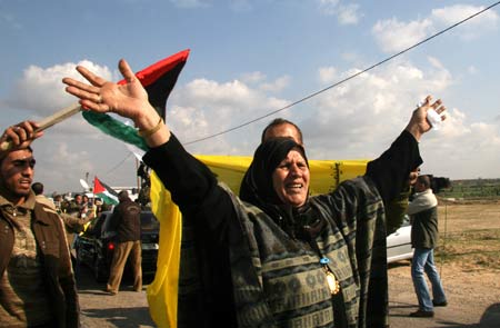 A Palestinian mother reacts after she saw her freed son arriving at Erez crossing point in northern Gaza Strip, Dec. 15, 2008. Israel released 224 Palestinians held in its prisons on Monday, nearly a week later than planned, in a move it described as a goodwill gesture to Palestinian President Mahmoud Abbas. 