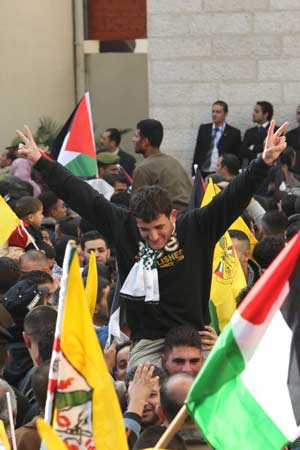 A Palestinian prisoner celebrates after he was freed by Israel in Ramallah on Dec. 15, 2008. Israel.