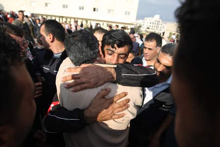 A Palestinian prisoner bursts into tears after reuniting with his family members in Ramallah on Dec. 15, 2008. 