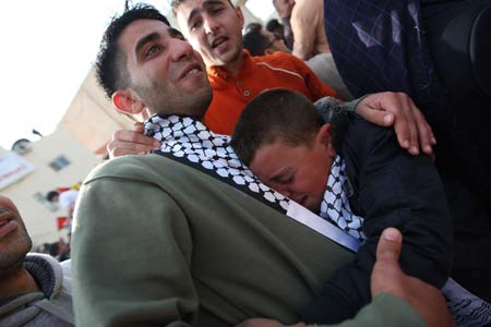 A Palestinian prisoner bursts into tears after reuniting with his family members in Ramallah on Dec. 15, 2008. 