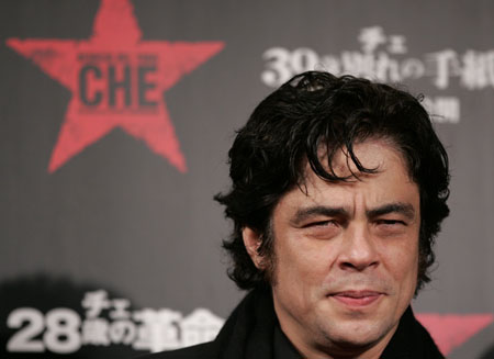 Cast member Benicio Del Toro smiles for photographers on the red carpet at the Japan premiere of the film 