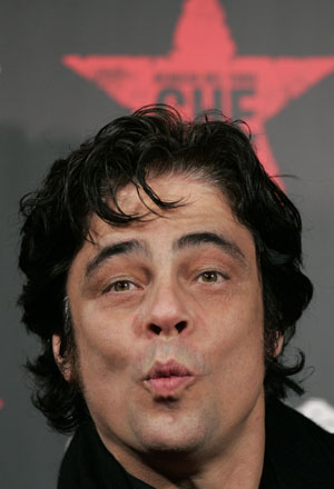 Cast member Benicio Del Toro pretends to kiss at the red carpet for the Japan premiere of the film 