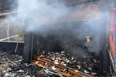 Photo taken on Dec. 17, 2008 shows the cloth store burned down in a fire in the Hanjiang District of Putian City, southeast China's Fujian Province. Five people died on Wednesday in a fire which broke out shortly after midnight in Putian City. It took firefighters three hours to put out the blaze under control. Investigation into the cause of the fire is underway. 