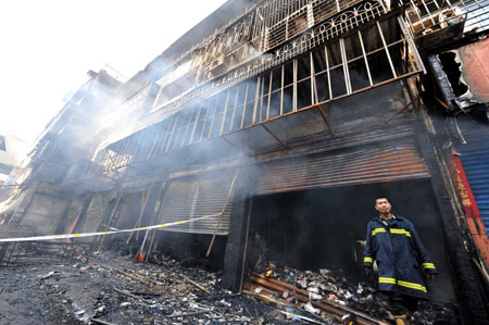 Photo taken on Dec. 17, 2008 shows the cloth store burned down in a fire in the Hanjiang District of Putian City, south China's Fujian Province. 